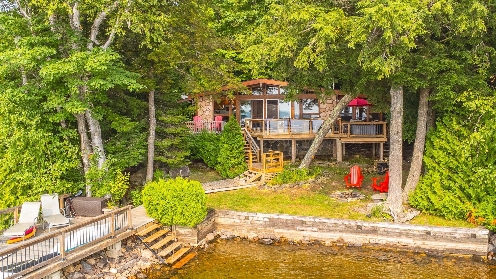 Kennisis lake waterfront cottage with a deck and dock