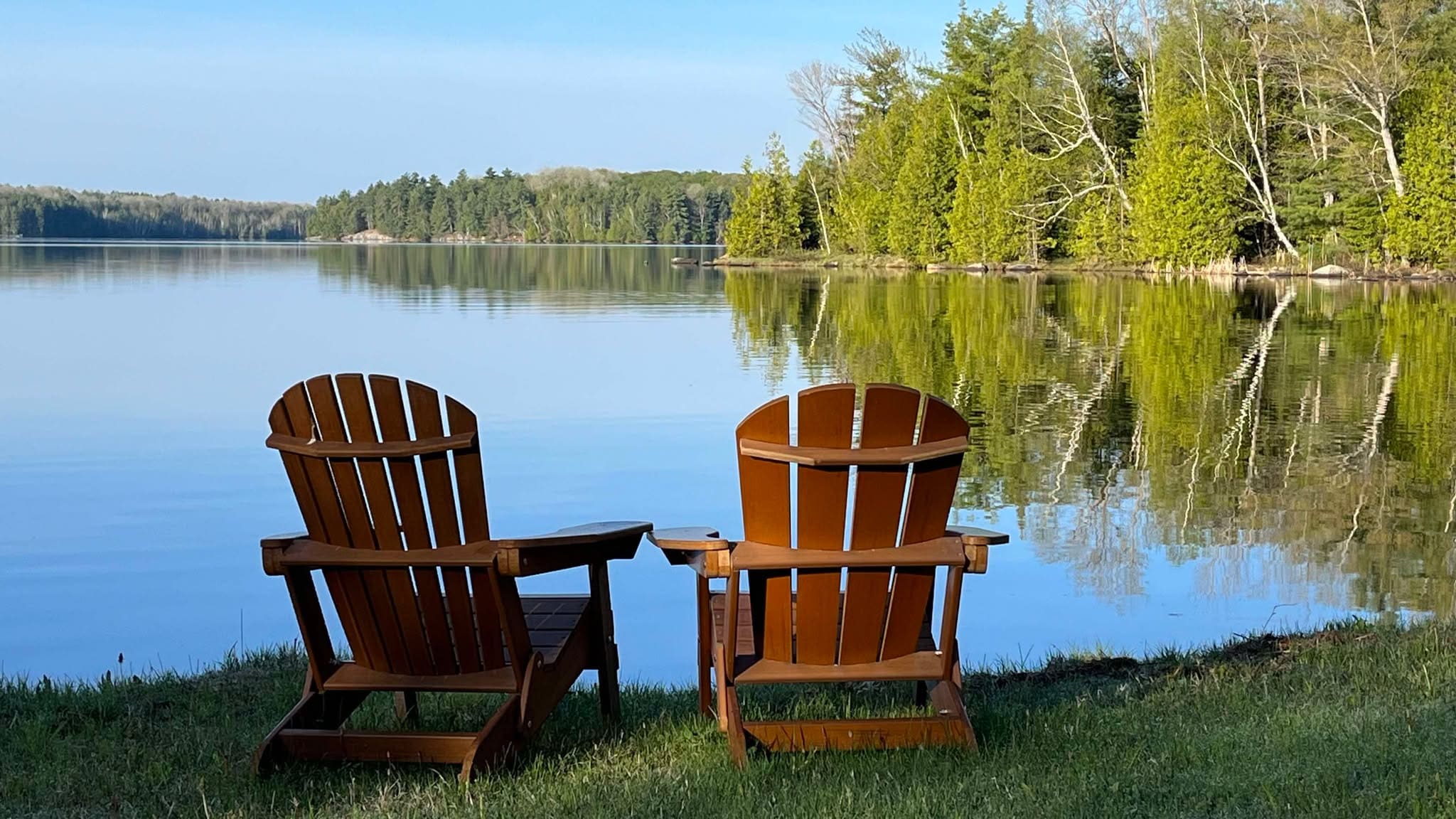 Frontenac County chairs on dock overlooking lake Frontenac County chairs on dock overlooking lake